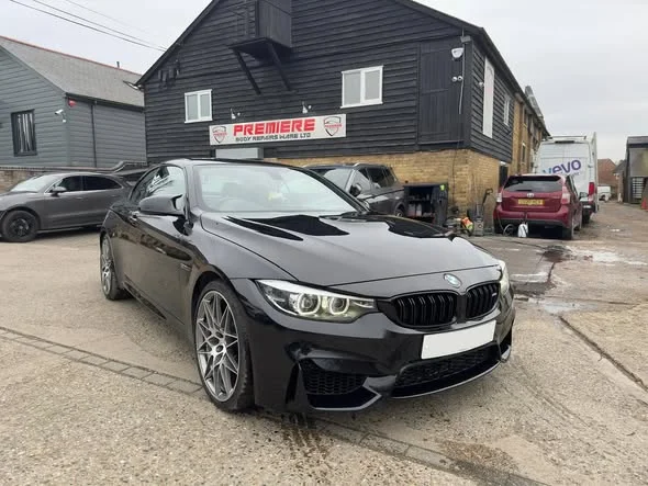 Black BMW M4 after repair